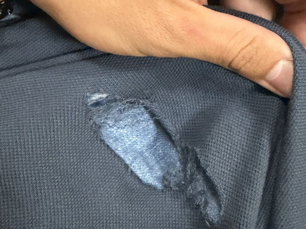 Preston's shirt, cut through by the knife